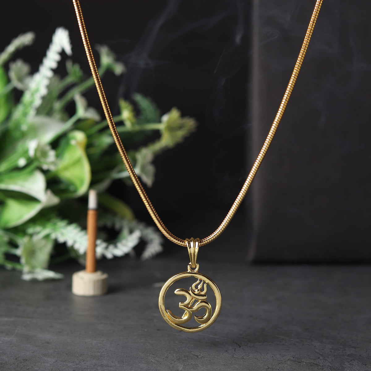 Gold Plated Om Circle Pendant Necklace on Display