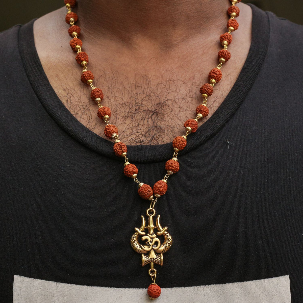 wearing a Rudraksha trishul necklace