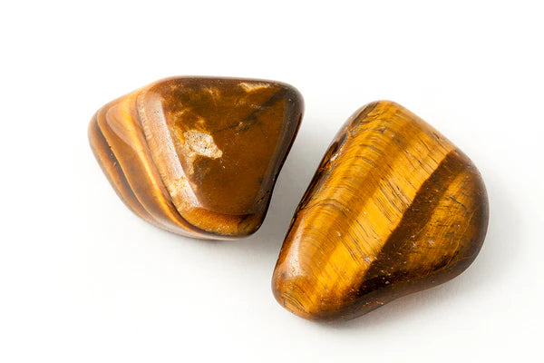 Natural Tiger Eye stones for confidence and spiritual grounding.